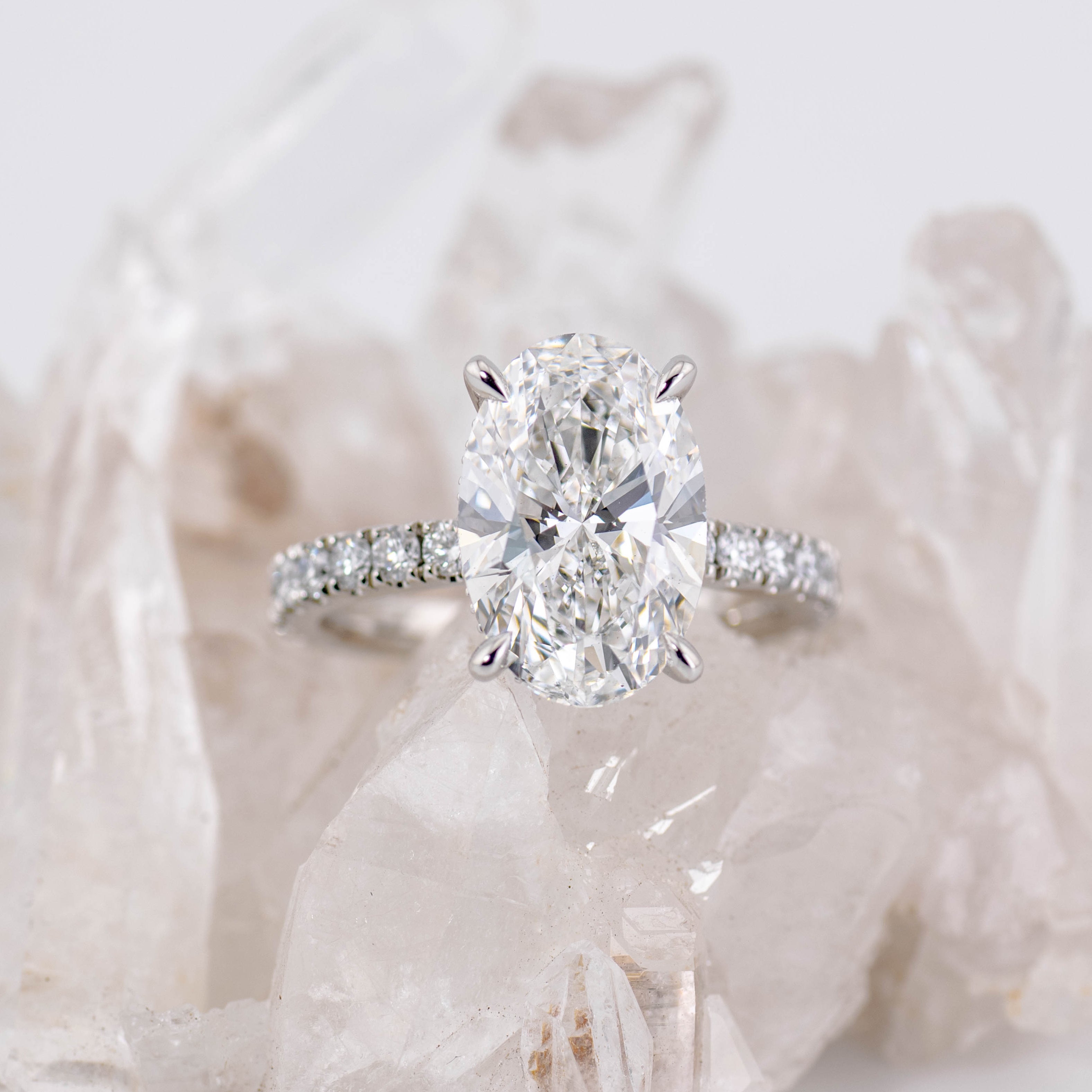 Custom Oval Solitaire with Hidden Halo and Pave Band