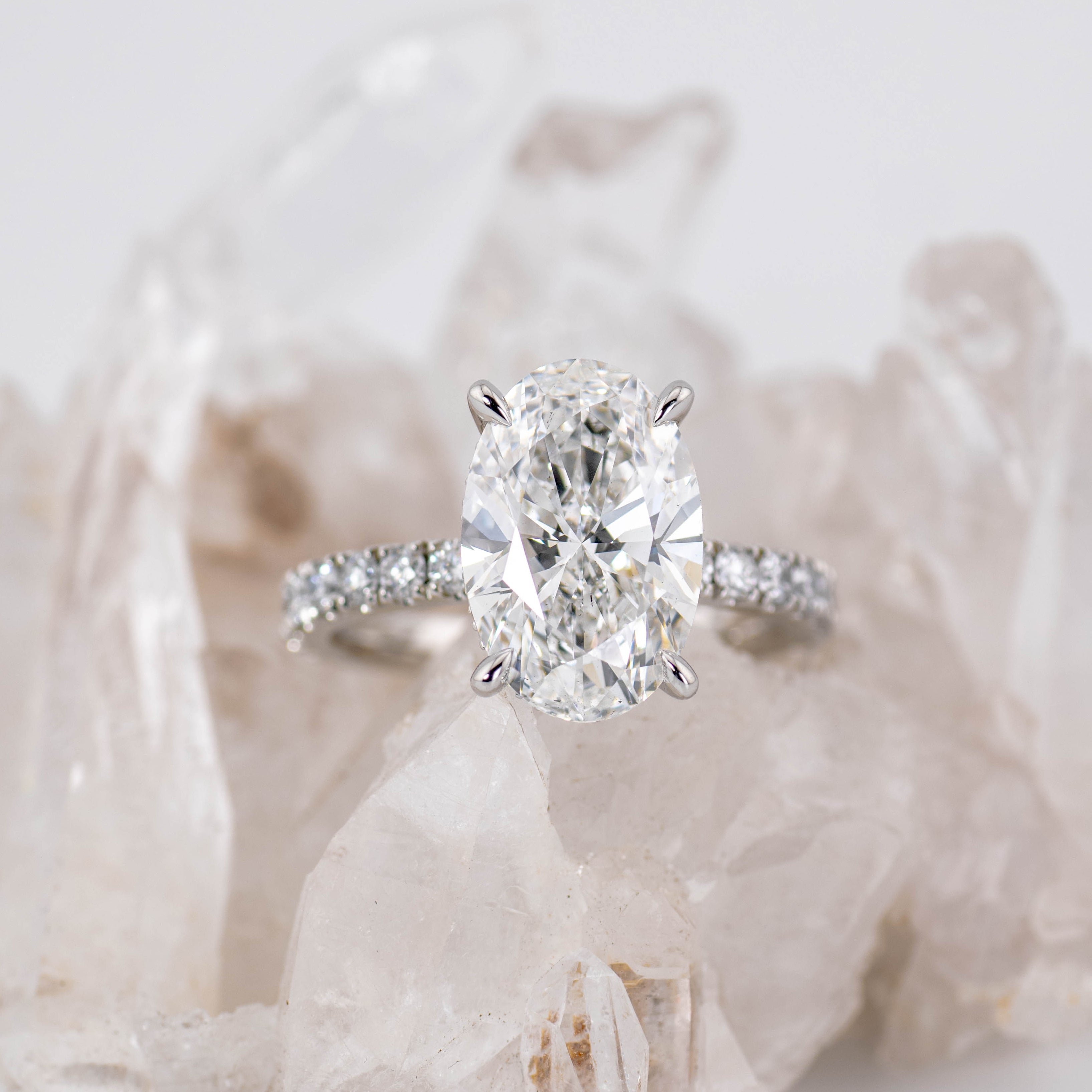 Custom Oval Solitaire with Hidden Halo and Pave Band