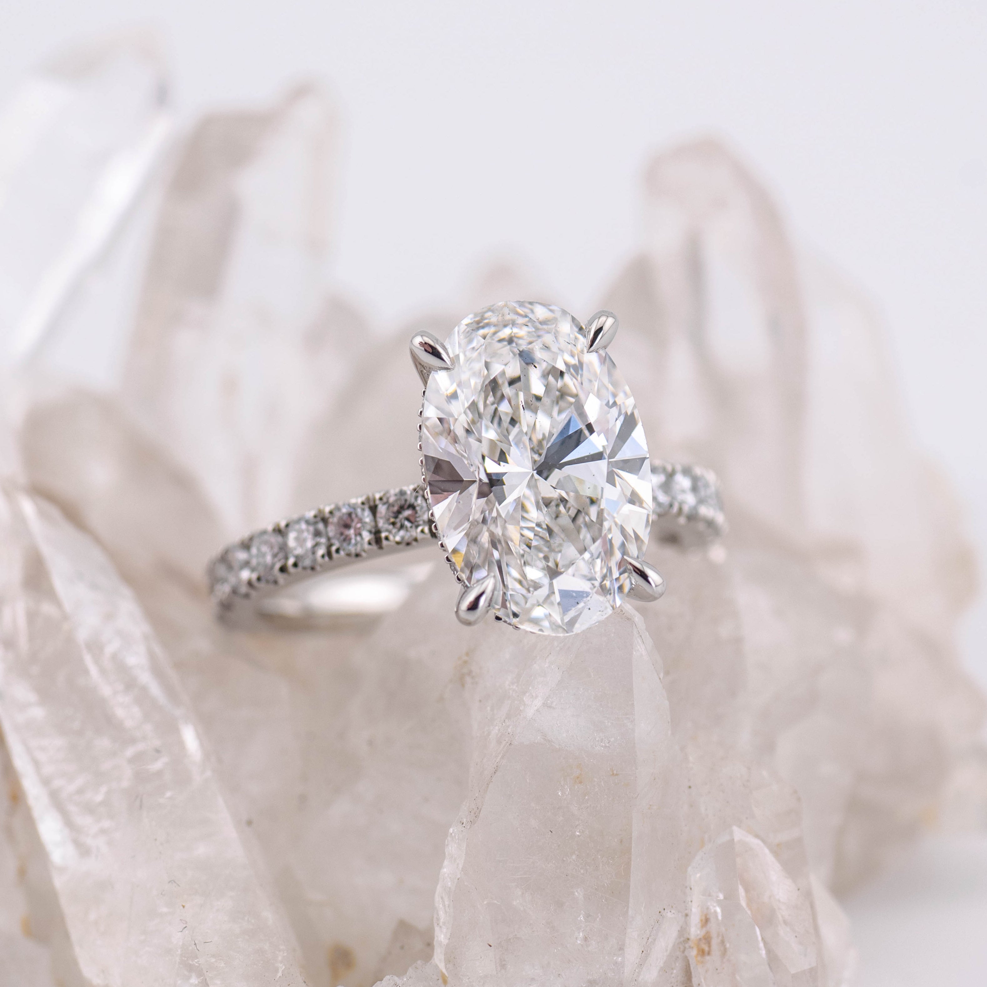 Custom Oval Solitaire with Hidden Halo and Pave Band