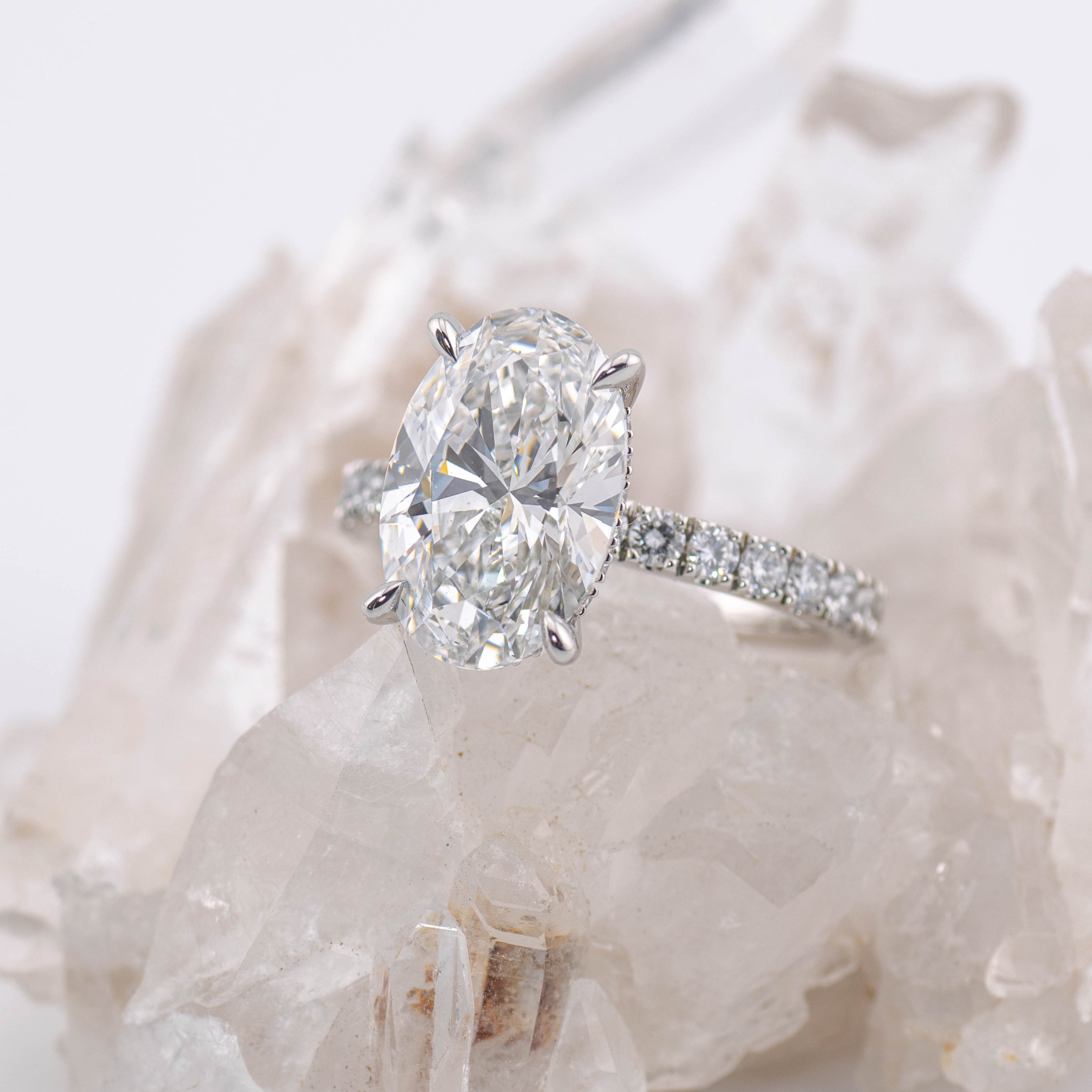 Custom Oval Solitaire with Hidden Halo and Pave Band