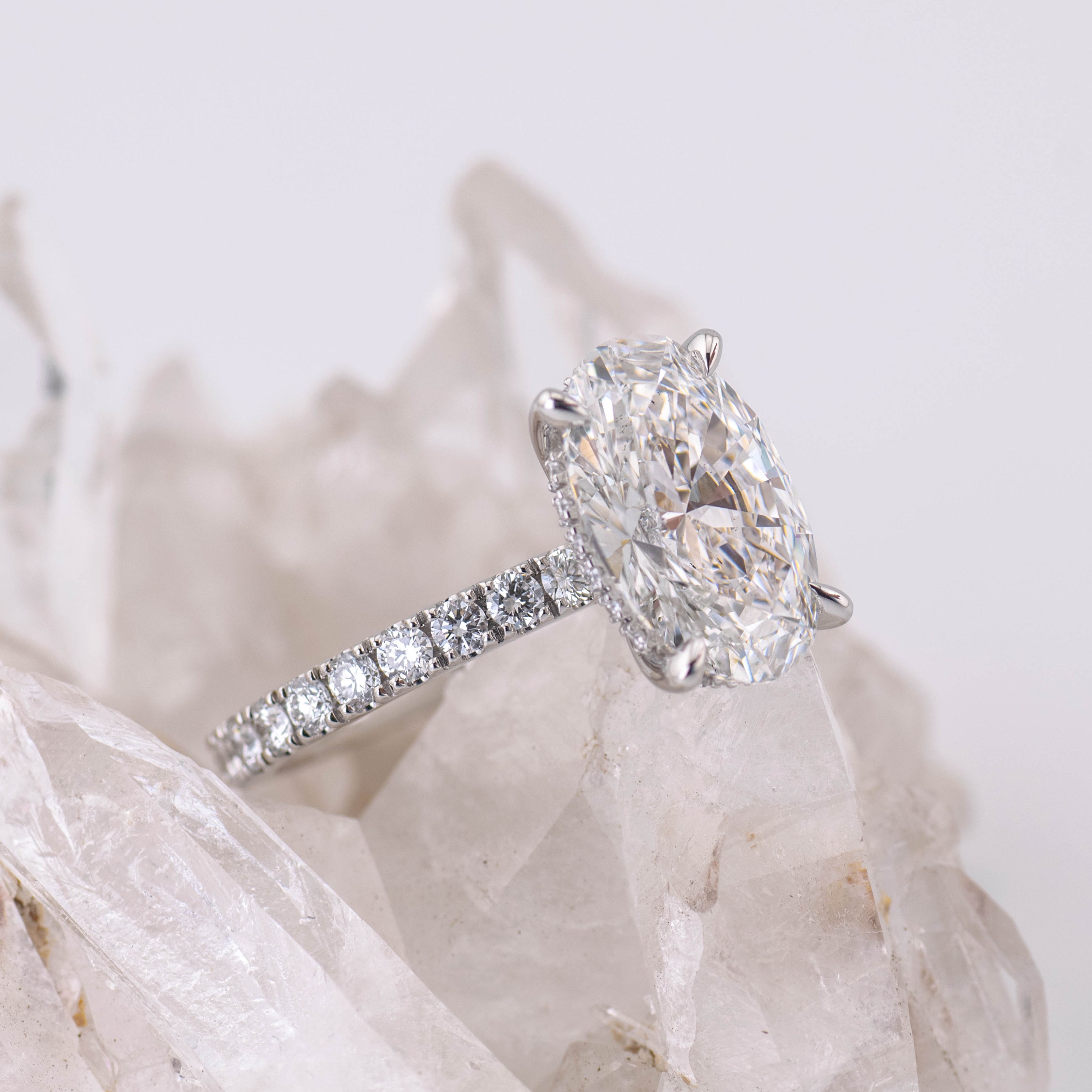 Custom Oval Solitaire with Hidden Halo and Pave Band