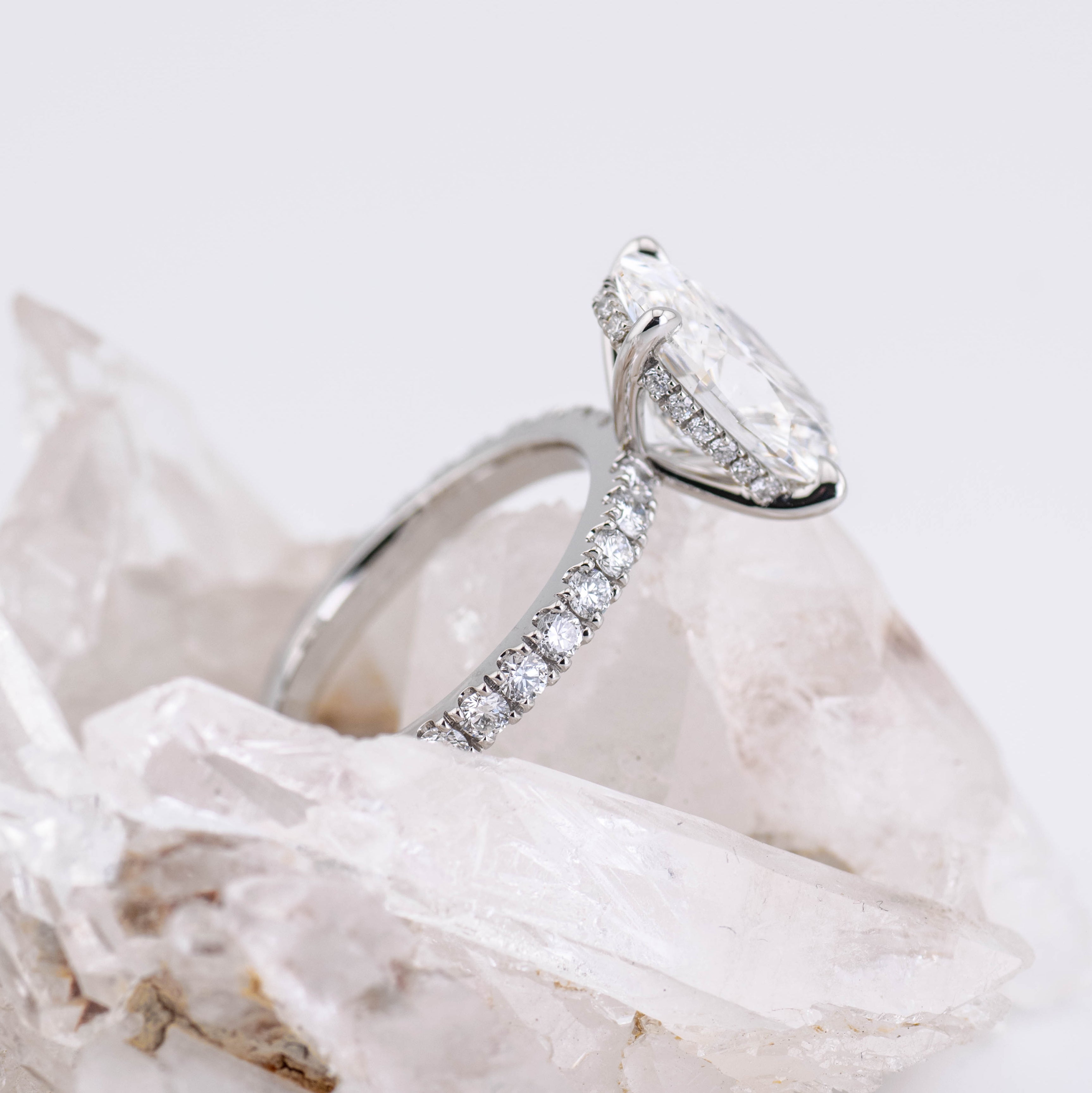 Custom Oval Solitaire with Hidden Halo and Pave Band